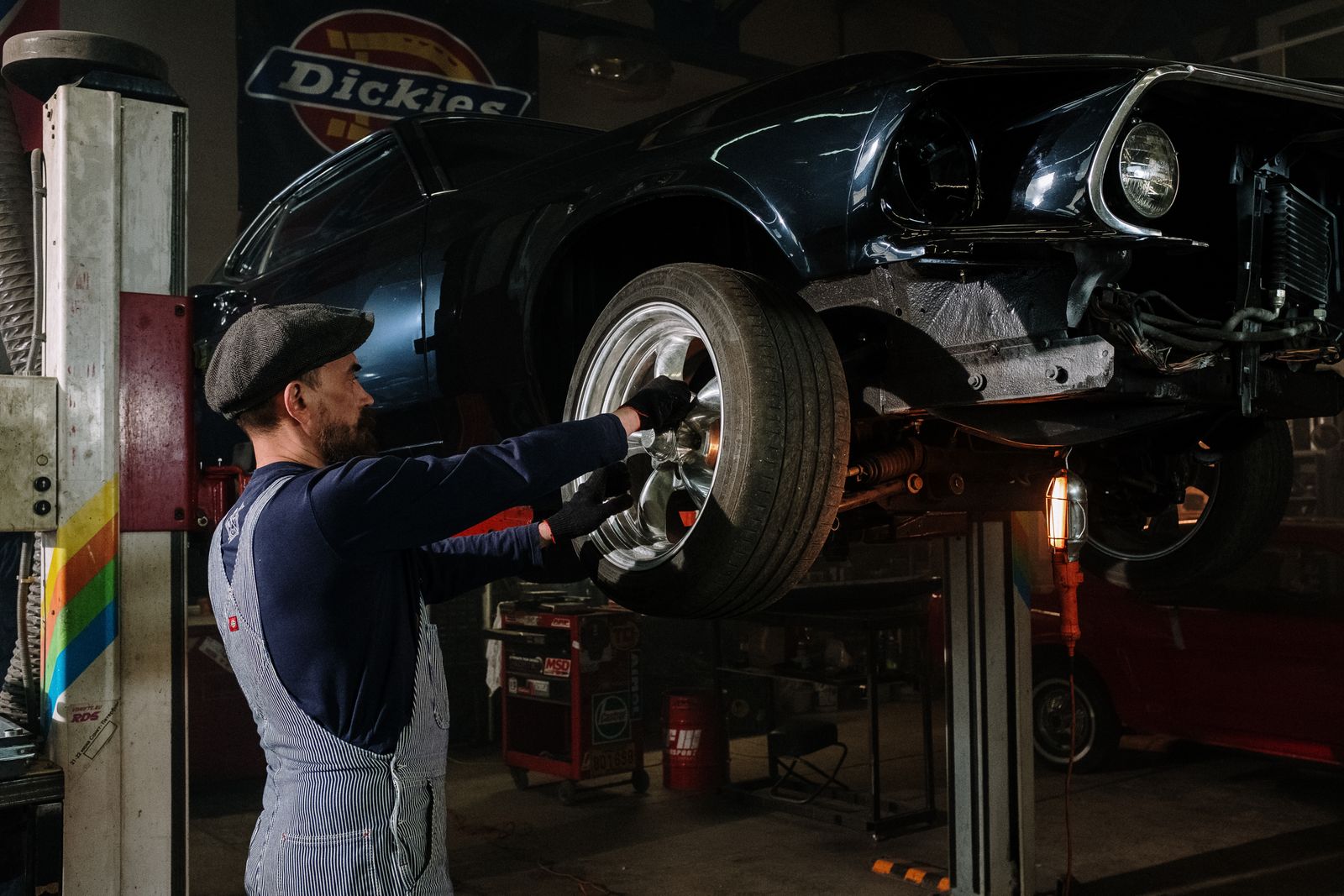 Mechanic working on a vehicle in a professional service bay